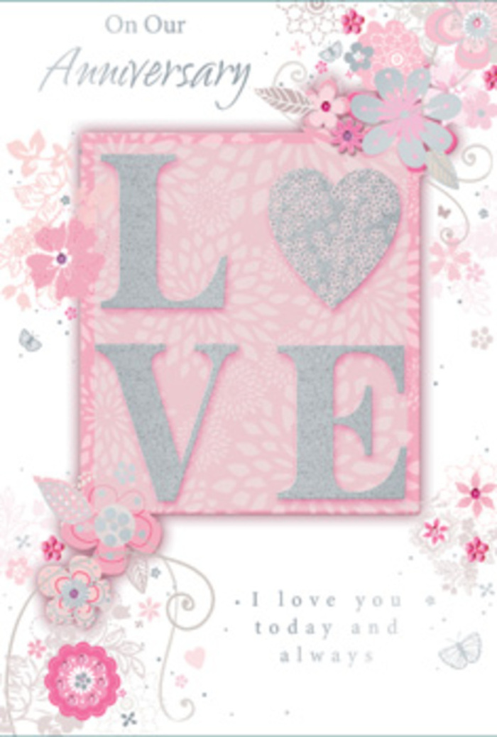 The anniversary card pictured here looks like a work of gentle paper floristry, capturing the emotion of a hand-tied bouquet you might pick up in De Beauvoir Town on the way home. Dominating the centre is the word LOVE, set in large, slightly rounded capitals that rise above the card's surface. Each letter is coated in a soft, glittering finish that blends blush pink, pearlescent white, and tiny accents of silver, so that when light touches it the effect is like sunshine glancing off petals in a shop window near De Beauvoir Square. The texture appears tactile and inviting, as though fingertips would feel a subtle, sandy sparkle. Flowing outwards from this focal word is an intricate garden of illustrated flowers and leaves, arranged in sweeping curves that frame the message. The blooms are stylised rather than botanically exact, but they recall roses, small wildflowers, and airy filler stems, all drawn in fine lines with gentle shading in pastel pinks, ivory whites, and soft dove greys, with sparks of silver foil echoing dewdrops. The background is a muted, velvety pink, evenly lit to give a sense of calm, like early morning light filtering into a De Beauvoir townhouse. Between the petals and vines, there are tiny spirals, dots, and filigree touches that add movement, similar to the way a florist might add wisps of greenery to keep an arrangement light. Near the lower part of the card, a graceful script in deep grey ink carries a tender anniversary sentiment, expressing lasting love and shared devotion. Overall, the card feels like a quiet celebration, the paper equivalent of a softly scented floral delivery placed lovingly on a table for an intimate evening together.