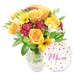 A sunlit, celebratory bouquet sits in a simple clear glass vase, the stems visible through water and trimmed cleanly by a careful hand. Up close you see large, peachy-orange roses with petals curling in soft spirals, their velvety faces warmed like late-afternoon light; beside them bright yellow gerbera daisies open like small suns, their dark brown centres providing a cheerful anchor. Deep burgundy carnations, densely ruffled and plush to the touch, give the arrangement a luxurious contrast, while delicate white alstroemeria-slender-petalled with faint speckles-drift through the composition, lending an airy, refined note. A generous cloud of glossy green foliage, from broad leaves to fine sprigs, cradles the blooms and adds fresh-scented depth; you can almost imagine the gentle green perfume when the bouquet is opened. To the lower right, slightly overlapping the vase, a round white foil balloon catches the light: it is playfully patterned with scattered gold and hot-pink polka dots and tiny hearts, and its centre carries the flowing hot-pink script message best Mum. The overall feeling is warm, intimate celebration-an arrangement that radiates gratitude and tenderness, perfect for Mother's Day, a birthday, or a simple surprise. The composition is photographed against a crisp white backdrop that makes the colours sing, and the overall craftsmanship suggests the work of a florist who understands balance, texture, and occasion. This bouquet reads as both joyful and sincere, designed to make a mother feel seen and cherished, and ideal for local delivery across De Beauvoir Town near De Beauvoir Square and the Regent's Canal.